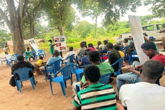 Community durbar gathering with traditional leaders advocating against NTD stigma